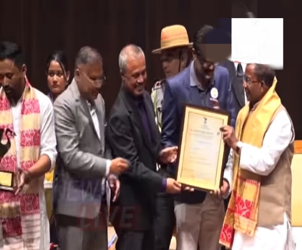 Assam Governor Lakshman Prasad Aacharya handing over the Dr. Bhabendra Nath Saikia Award for Best Screenplay 2020.